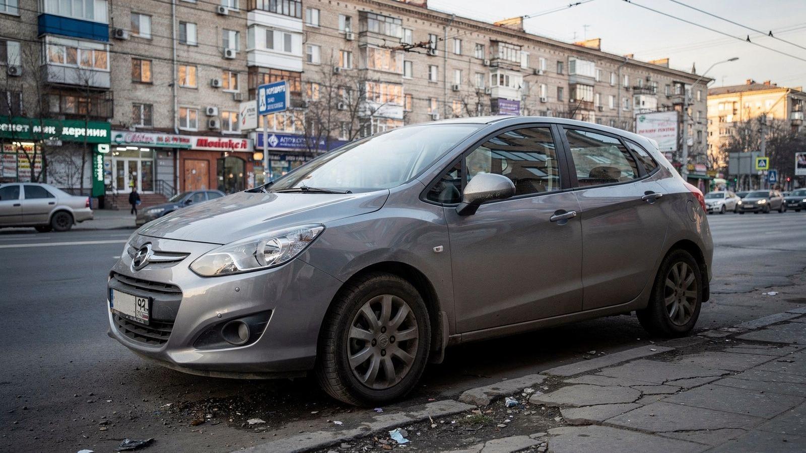Compact automatic hatchback parked on an inner-city street in Kyiv